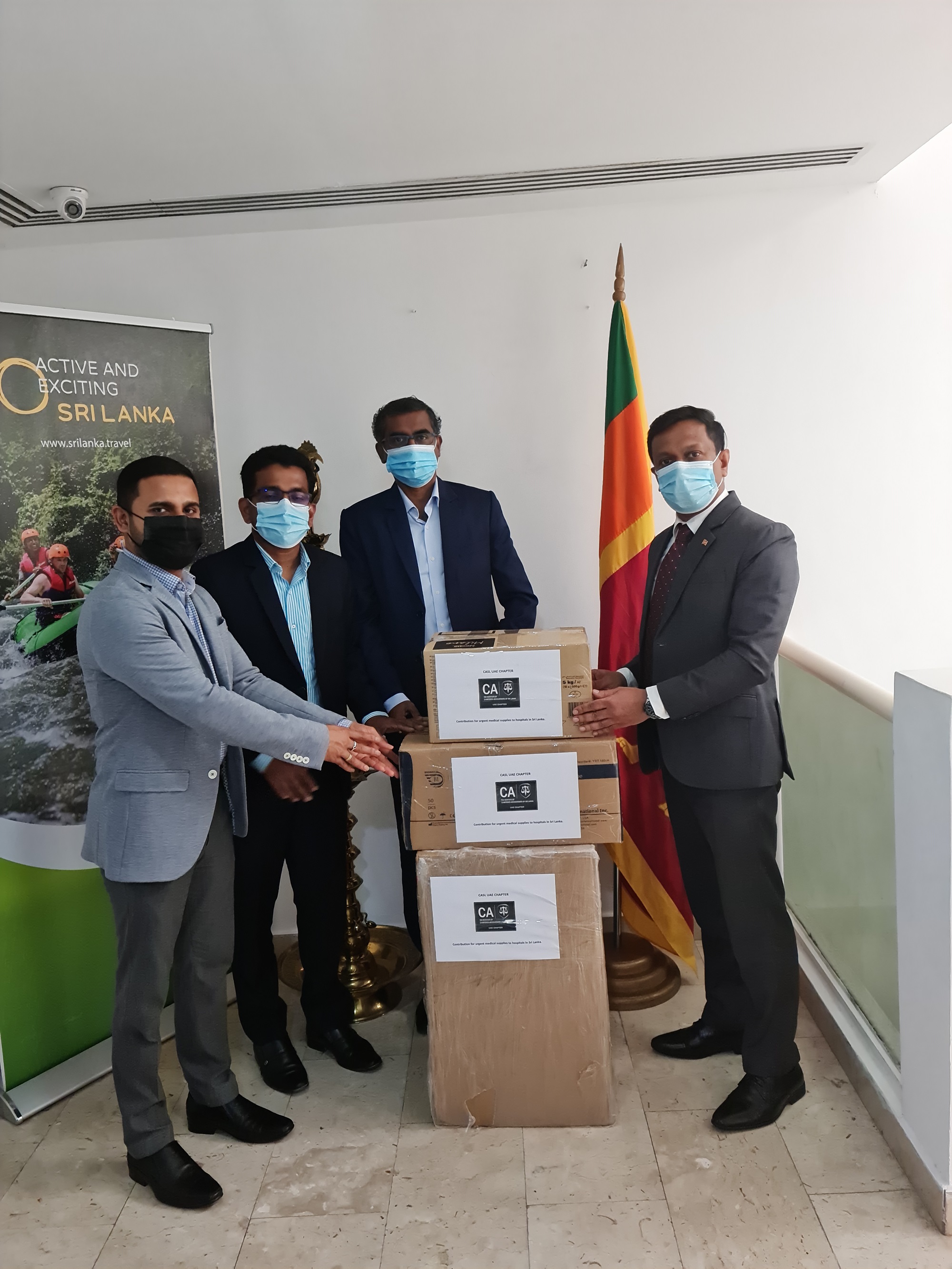 The consignment of medical supplies being handed over to the Consul General of Sri Lanka to Dubai and Northern Emirates by President of the CA Sri Lanka UAE Chapter Mr. Sajeep Kalinga, in the presence of Mr. S. Kirusantharaj and Mr. Indika Rathnayake.